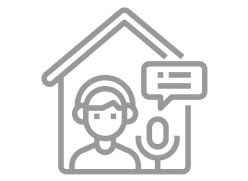 Person podcasting at home with microphone icon.