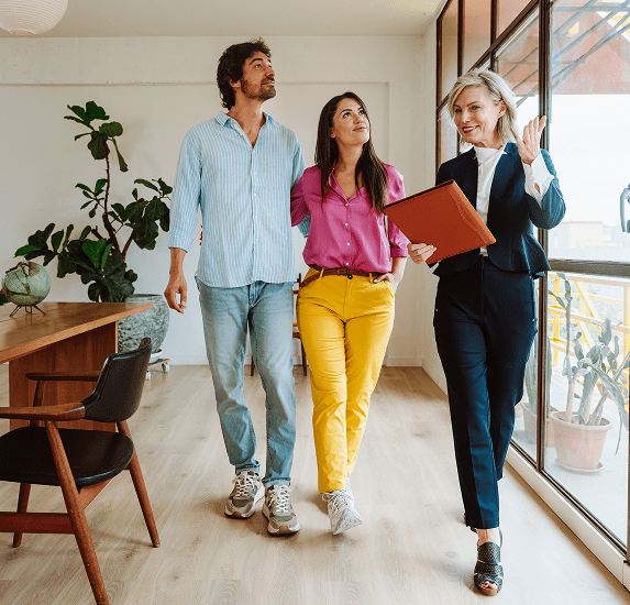 Real estate agent showing couple a property.